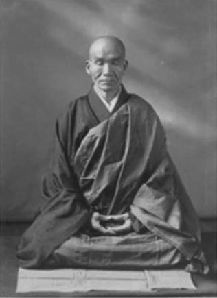 Kodo Sawaki sitting in meditation, seen from the front